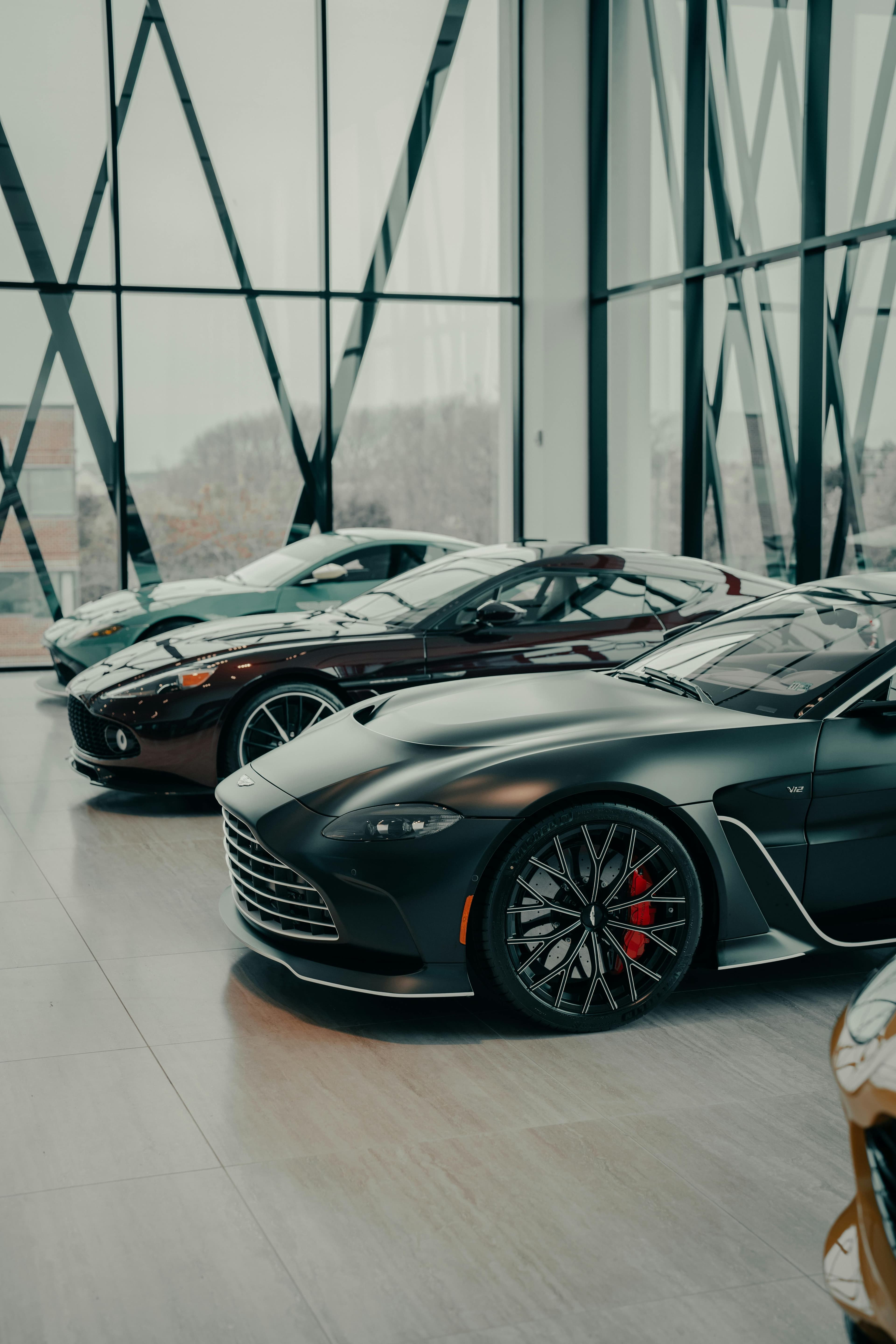 Silver performance car in a bright showroom